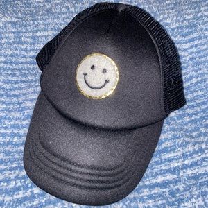 White smiley face trucker hat